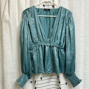 Fancy, metallic/shiny peplum balloon sleeve blouse